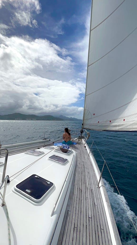 A thrilling sailing experience with cloudy skies and vast open sea, ideal for travel enthusiasts.
